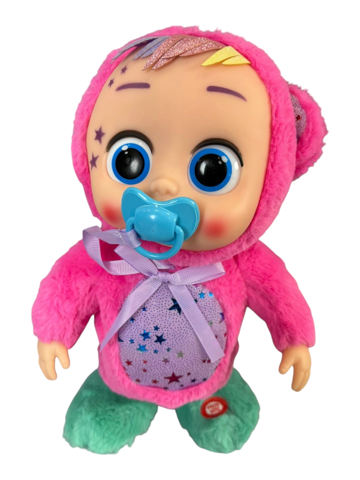 Muñeca interactiva EASY STORE de 30cm con disfraz de felpa rosa y verde, chupeta azul y detalles de estrellas.